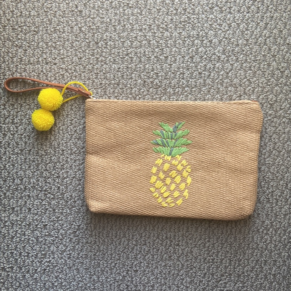 Francesca’s collection straw clutch with embroidered pineapple w/pompom tassel
